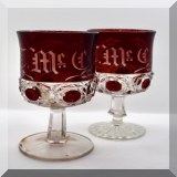 G89. Pair of red and clear glass monogrammed goblets. Different stems. - $ 